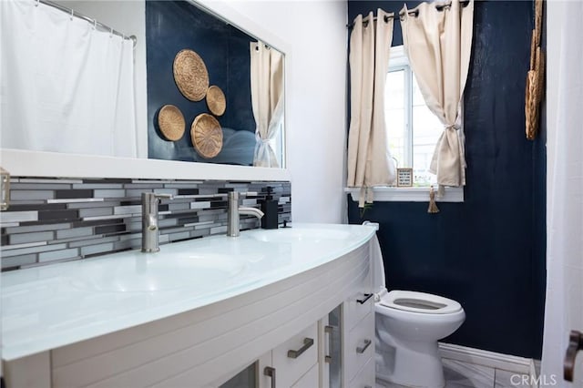 9021 Hegel St, Bellflower, CA 90706 - bathroom with backsplash, toilet, and vanity