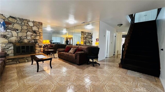 4127 W 130th St, Hawthorne, CA 90250 - living room with a stone fireplace and light tile patterned flooring