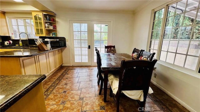 4127 W 130th St, Hawthorne, CA 90250 - dining area featuring plenty of natural light, ornamental molding, french doors, and stone finish flooring
