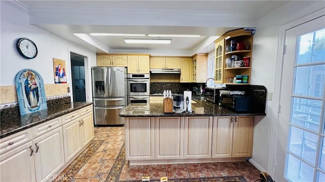 4127 W 130th St, Hawthorne, CA 90250 - kitchen featuring appliances with stainless steel finishes, a peninsula, under cabinet range hood, decorative backsplash, and dark stone counters