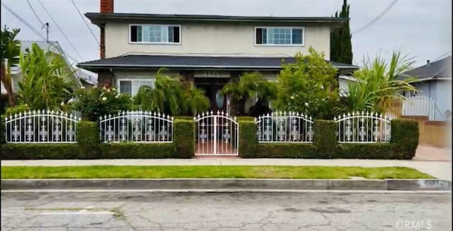 4127 W 130th St, Hawthorne, CA 90250 - view of front of property featuring stucco siding, a gate, and a chimney