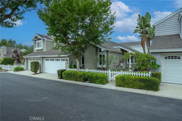 9 Edgestone, Irvine, CA 92606 - view of front facade featuring roof with shingles and driveway