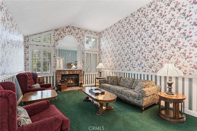 9 Edgestone, Irvine, CA 92606 - living area featuring wallpapered walls, lofted ceiling, a textured ceiling, a brick fireplace, and carpet floors
