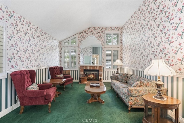 9 Edgestone, Irvine, CA 92606 - sitting room with wallpapered walls, vaulted ceiling, a textured ceiling, carpet flooring, and a brick fireplace