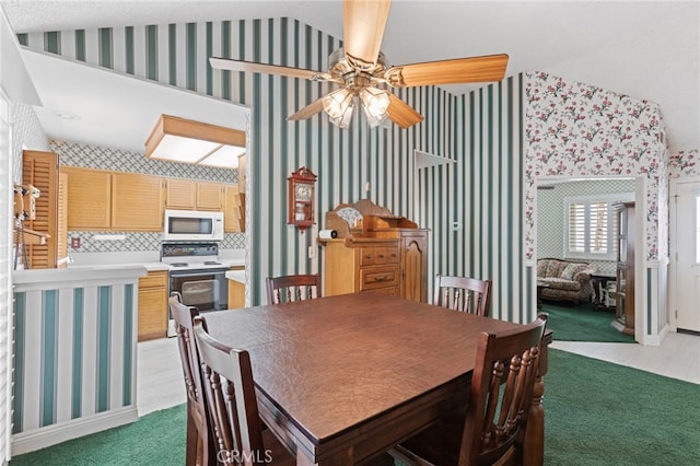 9 Edgestone, Irvine, CA 92606 - dining area with a ceiling fan, wallpapered walls, light carpet, and vaulted ceiling