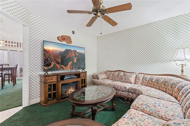 9 Edgestone, Irvine, CA 92606 - tiled living area featuring a textured ceiling, ceiling fan, and carpet