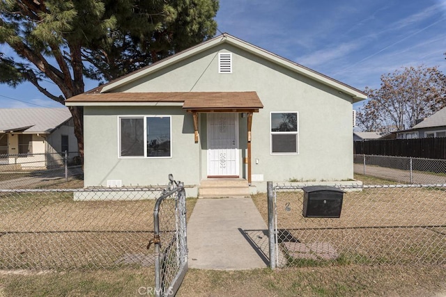 306 Belle Ave, Bakersfield, CA 93308 - bungalow featuring stucco siding and a fenced front yard