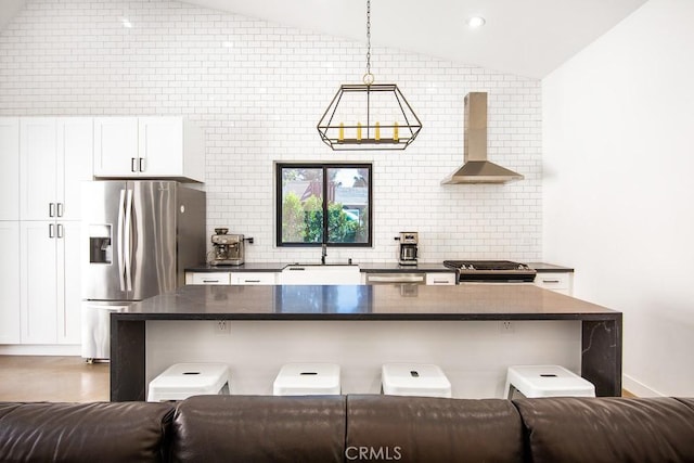 1923119229 Cantara St, Reseda, CA 91335 - kitchen with ventilation hood, appliances with stainless steel finishes, dark countertops, a sink, and lofted ceiling