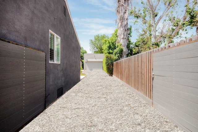 1923119229 Cantara St, Reseda, CA 91335 - view of side of home featuring stucco siding and crawl space
