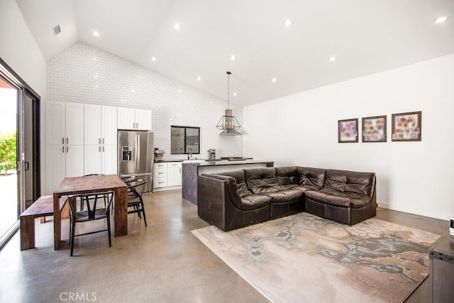 1923119229 Cantara St, Reseda, CA 91335 - living room with high vaulted ceiling, concrete flooring, and recessed lighting
