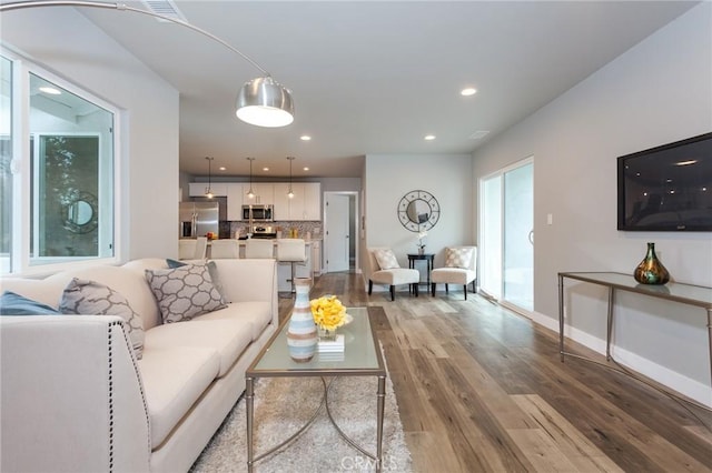 1923119229 Cantara St, Reseda, CA 91335 - living area with light wood-style floors, recessed lighting, and baseboards