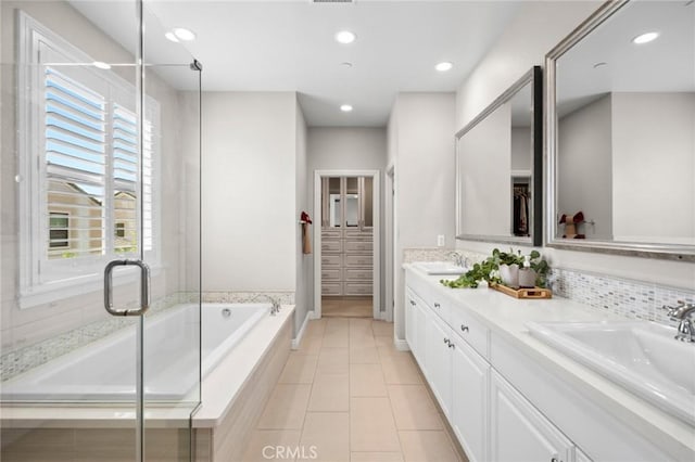108 Sideways, Irvine, CA 92618 - full bath featuring double vanity, a bath, tile patterned floors, a shower stall, and recessed lighting
