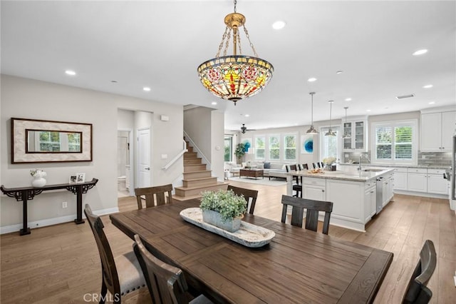108 Sideways, Irvine, CA 92618 - dining area with recessed lighting, light wood-style floors, stairway, and ceiling fan