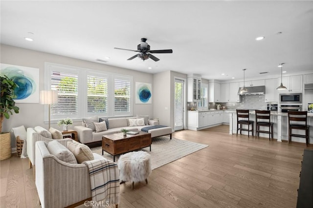108 Sideways, Irvine, CA 92618 - living room featuring plenty of natural light, light wood-style floors, a ceiling fan, and recessed lighting