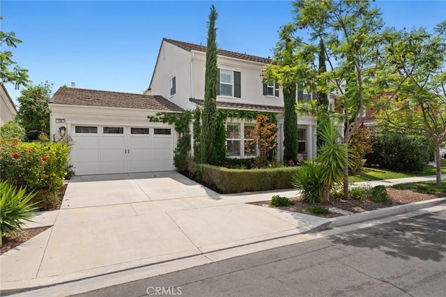 108 Sideways, Irvine, CA 92618 - view of front of home with stucco siding, driveway, and an attached garage