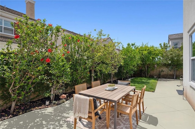 108 Sideways, Irvine, CA 92618 - fenced backyard featuring a patio area and outdoor dining space