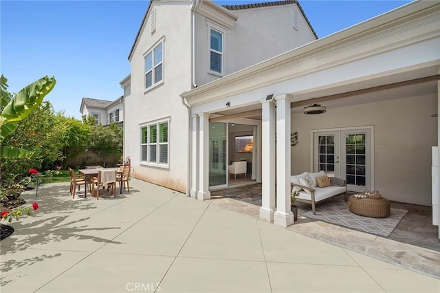 108 Sideways, Irvine, CA 92618 - back of property featuring stucco siding, a patio, french doors, and outdoor dining area