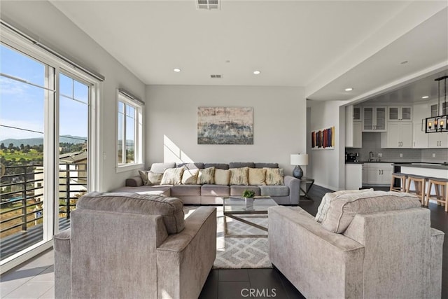 3610 Kinney St, Los Angeles, CA 90065 - tiled living room with recessed lighting and a sink