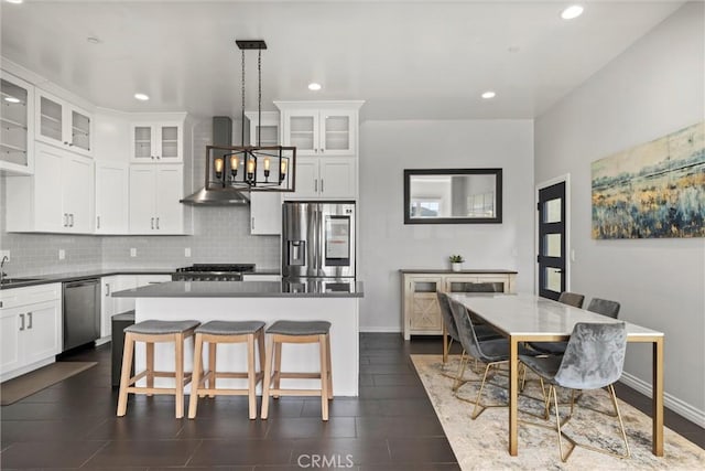 3610 Kinney St, Los Angeles, CA 90065 - kitchen featuring stainless steel appliances, tasteful backsplash, a kitchen island, recessed lighting, and white cabinets