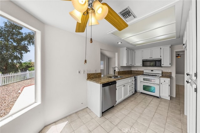 40661 Via Amapola, Murrieta, CA 92562 - kitchen with double oven range, stainless steel dishwasher, black microwave, a sink, and light tile patterned floors