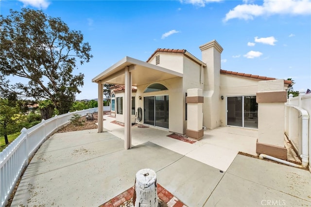 40661 Via Amapola, Murrieta, CA 92562 - rear view of house featuring stucco siding, a tiled roof, a patio, and a fenced backyard