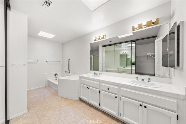 40661 Via Amapola, Murrieta, CA 92562 - full bathroom featuring double vanity, a bath, tile patterned flooring, and baseboards