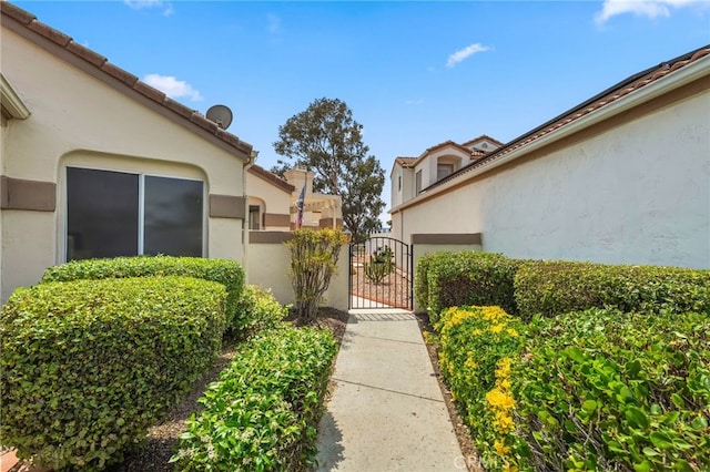 40661 Via Amapola, Murrieta, CA 92562 - view of exterior entry with a gate and stucco siding