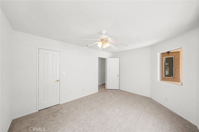 40661 Via Amapola, Murrieta, CA 92562 - unfurnished bedroom with light colored carpet, baseboards, and a ceiling fan