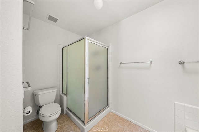 40661 Via Amapola, Murrieta, CA 92562 - bathroom with a stall shower, toilet, baseboards, and tile patterned flooring
