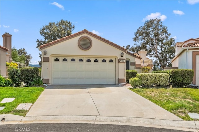40661 Via Amapola, Murrieta, CA 92562 - mediterranean / spanish-style home featuring concrete driveway, stucco siding, a tile roof, and an attached garage