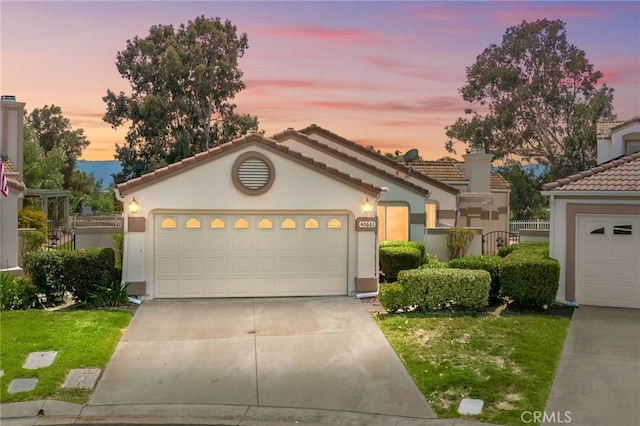 40661 Via Amapola, Murrieta, CA 92562 - view of front of house featuring concrete driveway, stucco siding, a tiled roof, and an attached garage