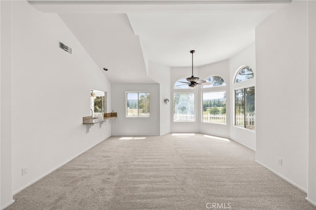 40661 Via Amapola, Murrieta, CA 92562 - unfurnished living room with carpet floors, a ceiling fan, high vaulted ceiling, and baseboards