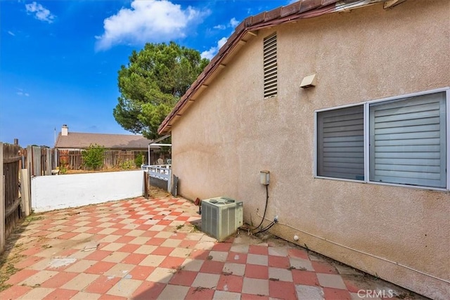 162 Peppertree Way, San Jacinto, CA 92583 - view of side of home featuring central AC, a patio area, and stucco siding