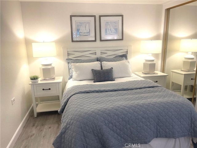 1411 Pelham Rd Unit 664H, Seal Beach, CA 90740 - bedroom featuring wood finished floors and baseboards