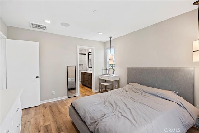 7436 Royal St, Buena Park, CA 90620 - bedroom featuring light wood finished floors, baseboards, recessed lighting, and connected bathroom