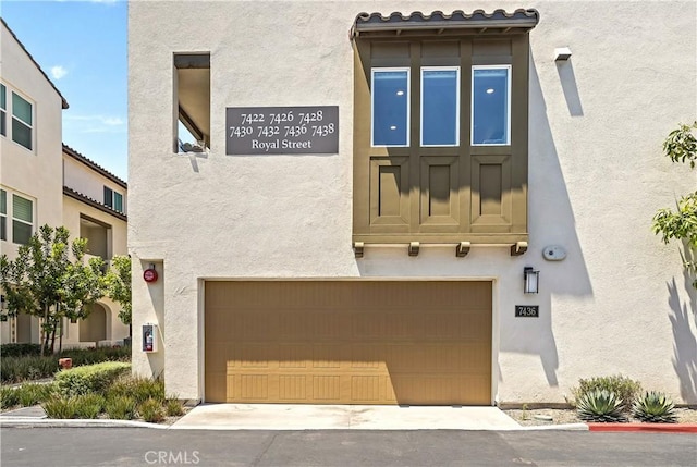 7436 Royal St, Buena Park, CA 90620 - property entrance with stucco siding and an attached garage