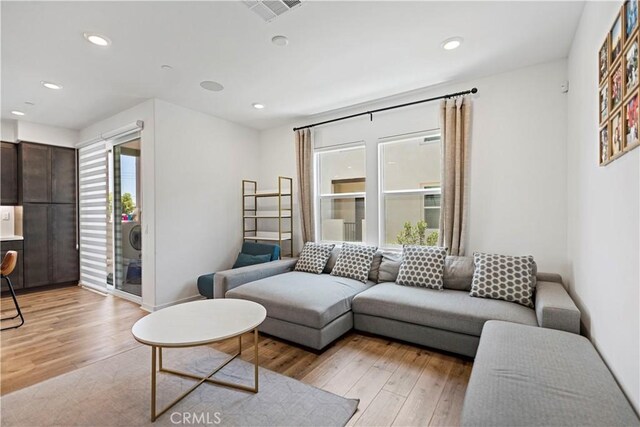 7436 Royal St, Buena Park, CA 90620 - living area with plenty of natural light, light wood-style flooring, recessed lighting, and baseboards