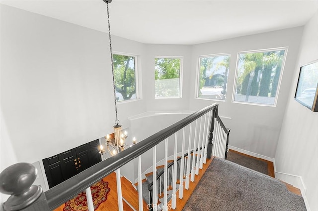 1270 Belle Rd, Calimesa, CA 92320 - staircase with wood finished floors, baseboards, and a chandelier
