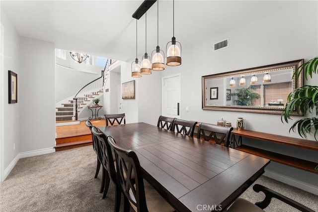 1270 Belle Rd, Calimesa, CA 92320 - dining area with stairs, carpet floors, and a chandelier