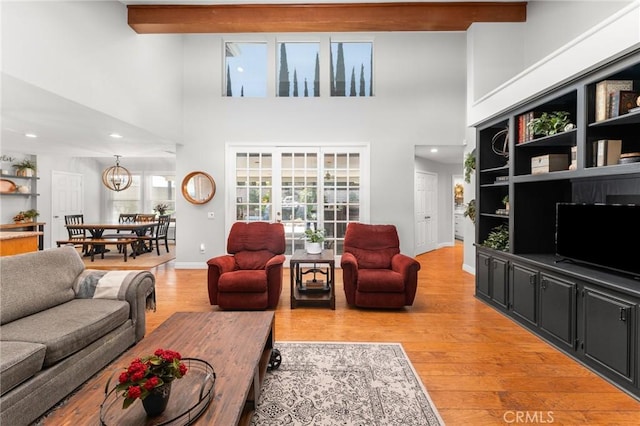 1270 Belle Rd, Calimesa, CA 92320 - living room featuring a towering ceiling, light wood finished floors, beam ceiling, a chandelier, and recessed lighting