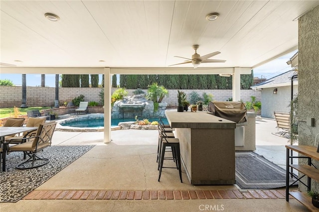 1270 Belle Rd, Calimesa, CA 92320 - fenced backyard with an outdoor bar, a patio area, a ceiling fan, and grilling area