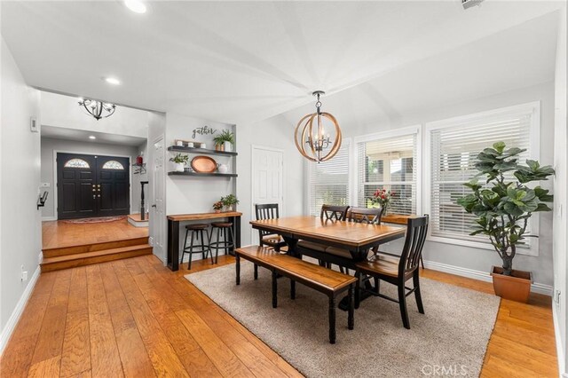 1270 Belle Rd, Calimesa, CA 92320 - dining room with a chandelier, light wood-style flooring, recessed lighting, and vaulted ceiling