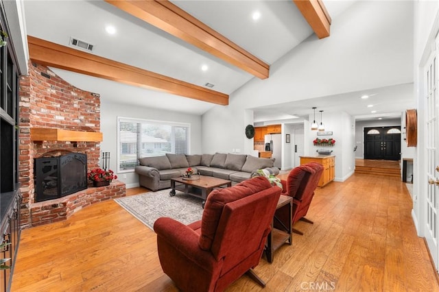 1270 Belle Rd, Calimesa, CA 92320 - living room with a fireplace, light wood-style floors, and recessed lighting