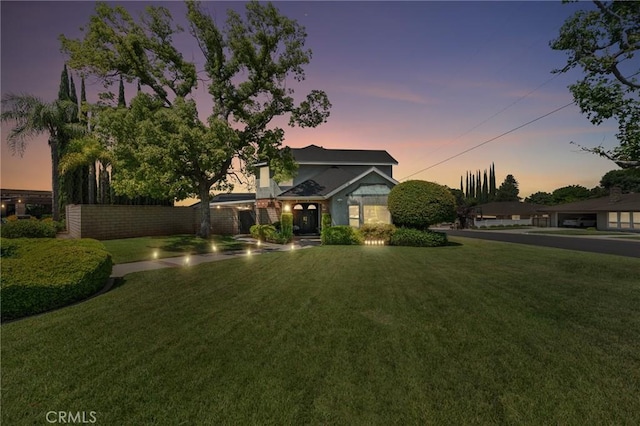 1270 Belle Rd, Calimesa, CA 92320 - view of front of home featuring a lawn and stucco siding