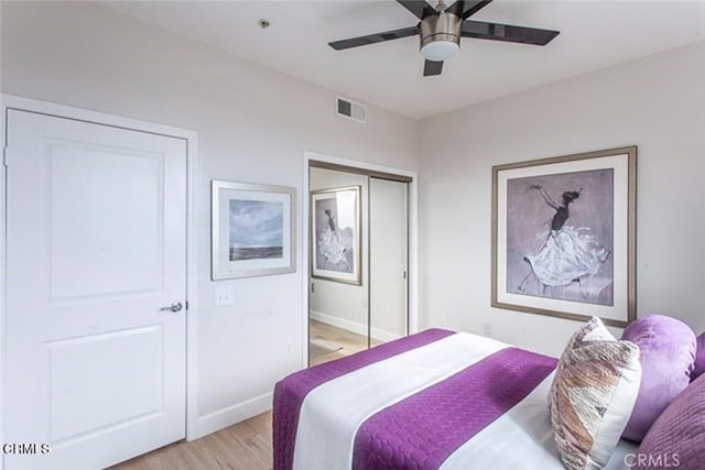 6938 Laurel Canyon Blvd Unit 214, North Hollywood, CA 91605 - bedroom featuring light wood finished floors, baseboards, a ceiling fan, and a closet
