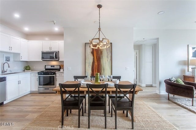 6938 Laurel Canyon Blvd Unit 214, North Hollywood, CA 91605 - dining room featuring a chandelier, light wood-type flooring, and recessed lighting
