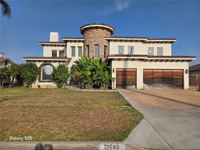 10040 Mattock Ave, Downey, CA 90240 - mediterranean / spanish-style house featuring stucco siding, an attached garage, concrete driveway, a front lawn, and a tiled roof