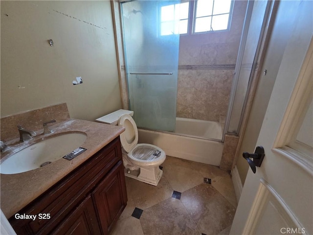10040 Mattock Ave, Downey, CA 90240 - bathroom featuring toilet, shower / bath combination with glass door, and vanity