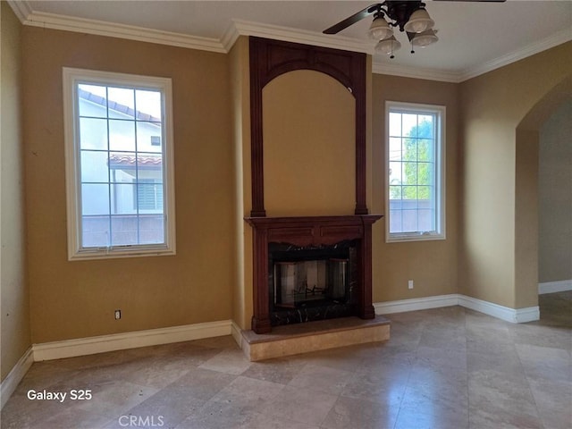 10040 Mattock Ave, Downey, CA 90240 - unfurnished living room with ornamental molding, arched walkways, a ceiling fan, and baseboards