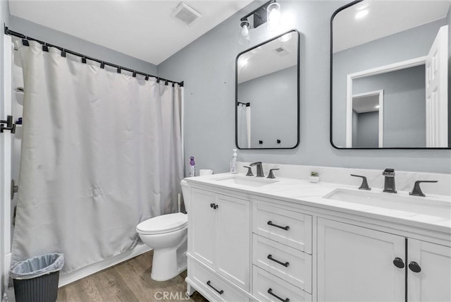 1264 N Mulberry Ave, Rialto, CA 92376 - bathroom featuring double vanity and wood finished floors